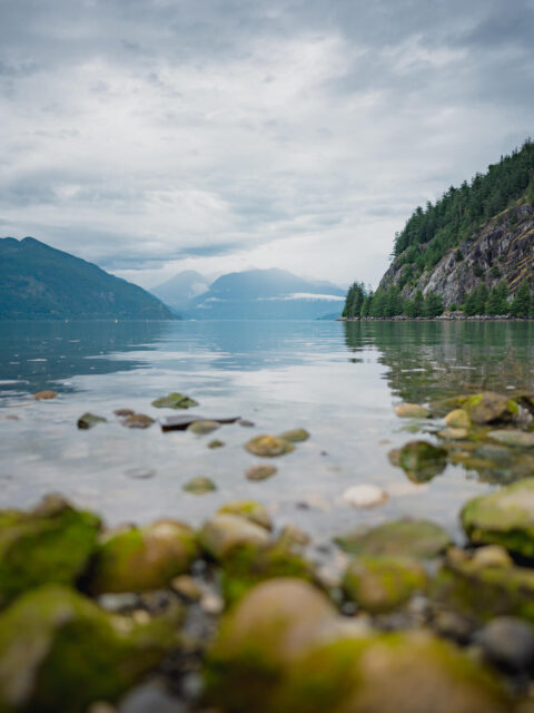 Porteau Cove view from low angle towards Howe Sound and the mountains in the background