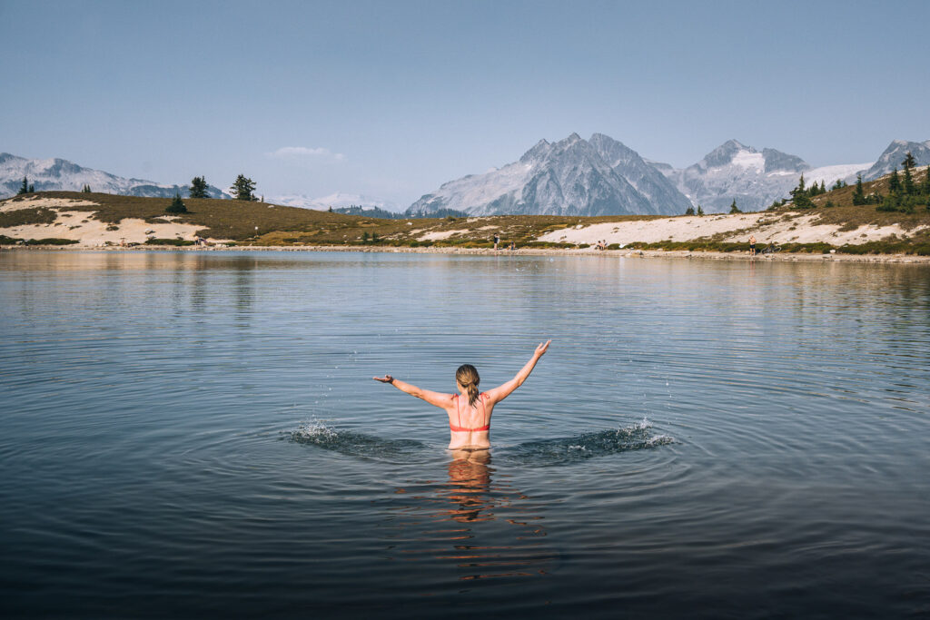 woman splashing water in Elfin Lake