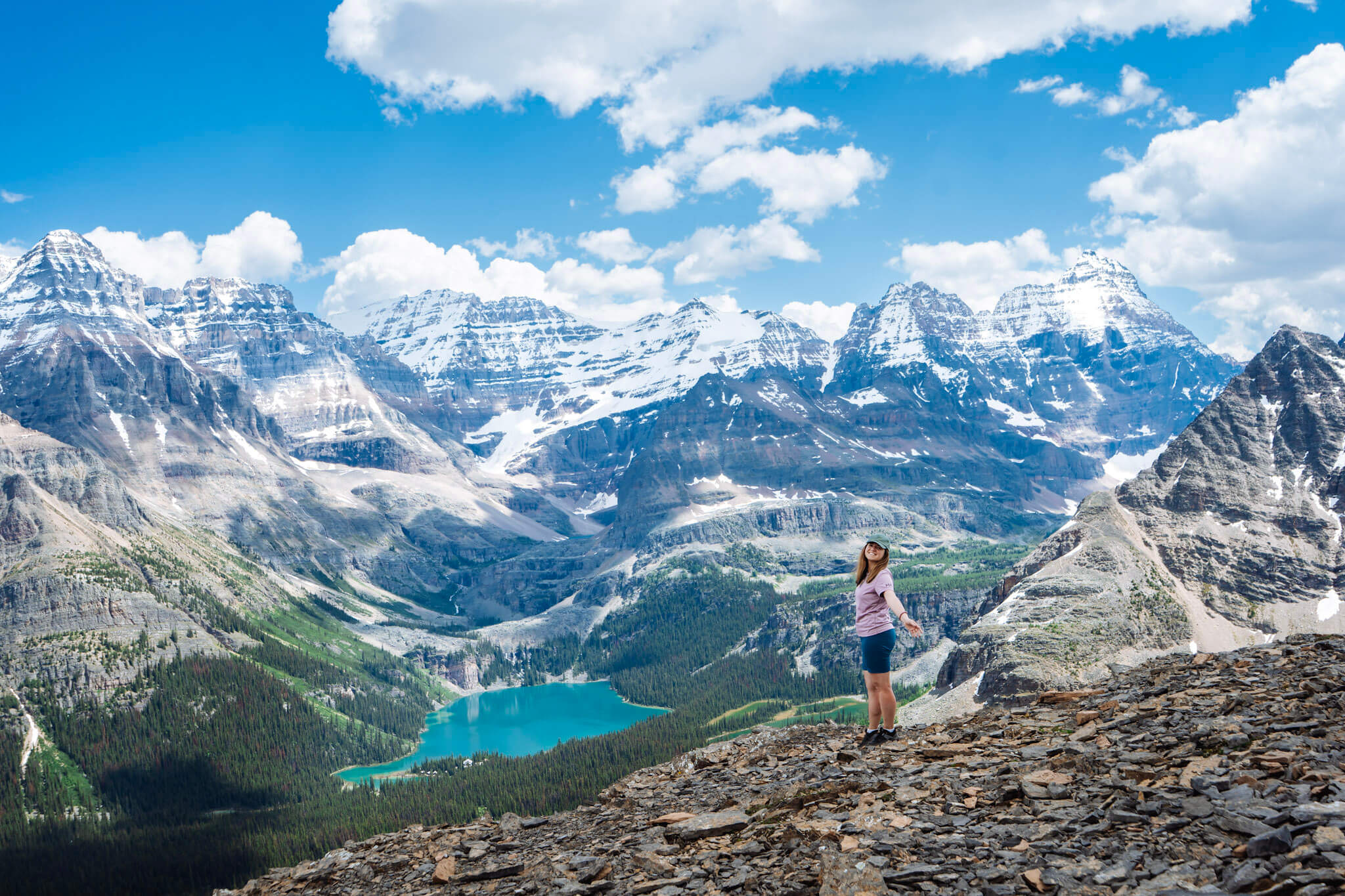 Hiker at Odaray Grandview lookout with Lake O'Hara in the background