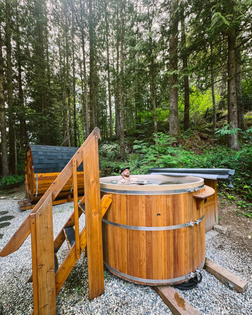 Man relaxing in a hot tub at Moonshine Spa